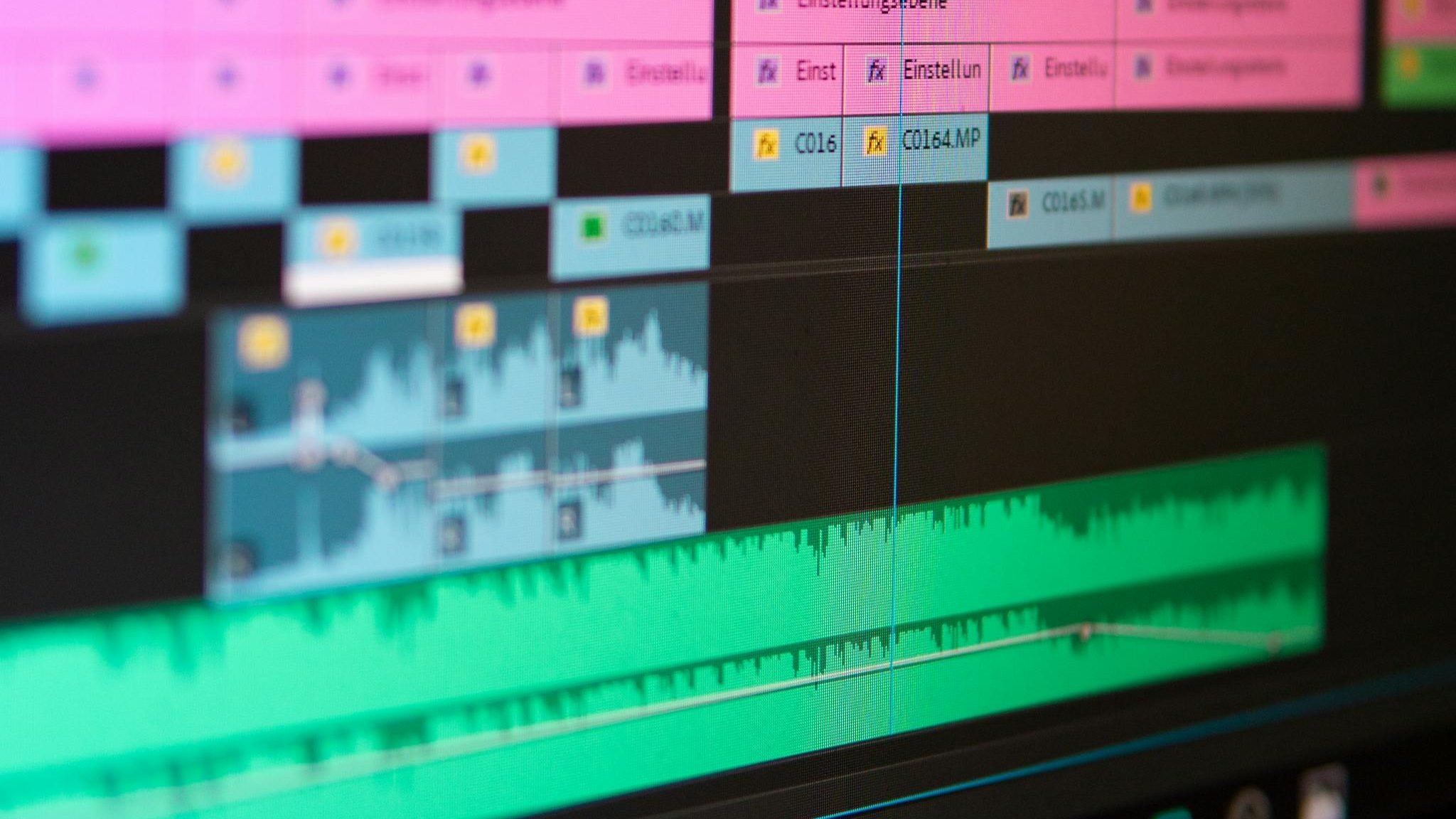 Close-up view of a video editing session window with multiple layered audio tracks.